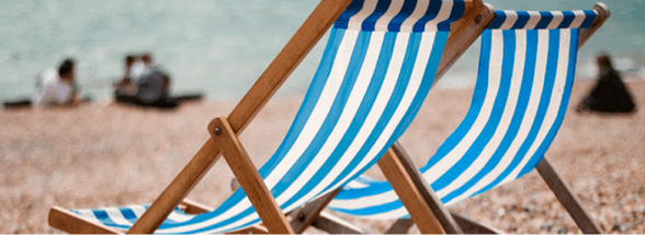 Blue and White Beach Chairs on Beach